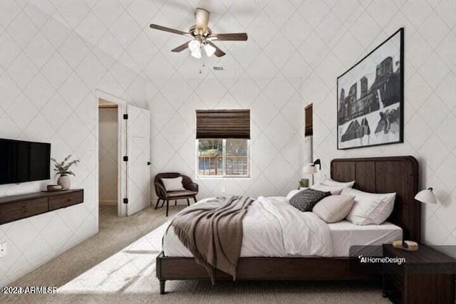 bedroom with ceiling fan and light carpet