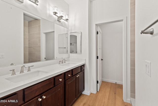 bathroom featuring hardwood / wood-style flooring and vanity