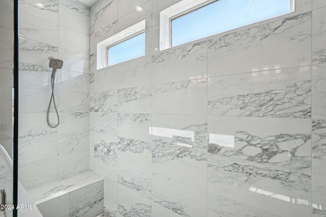 bathroom featuring tiled shower