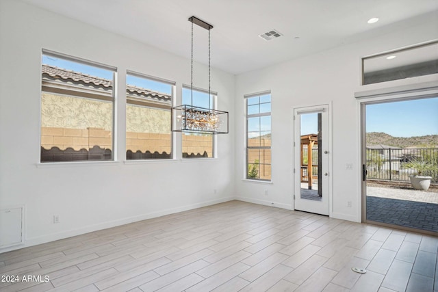 unfurnished room with recessed lighting, visible vents, baseboards, and light wood finished floors