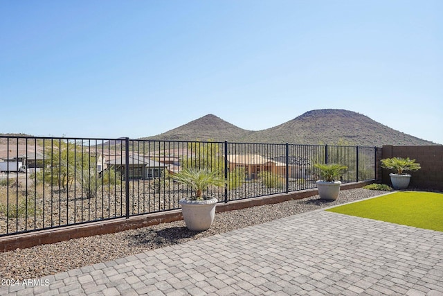 view of patio featuring a fenced backyard and a mountain view