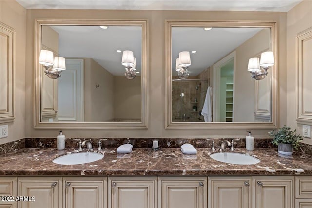 bathroom featuring vanity and an enclosed shower