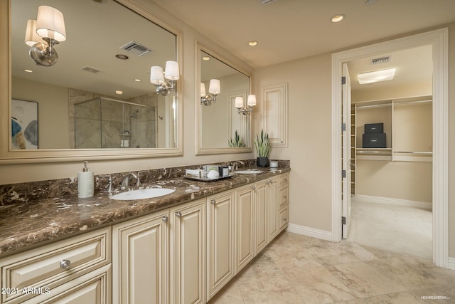 bathroom with vanity and a shower with shower door