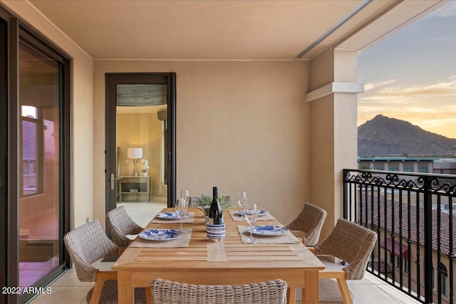 balcony at dusk with a mountain view