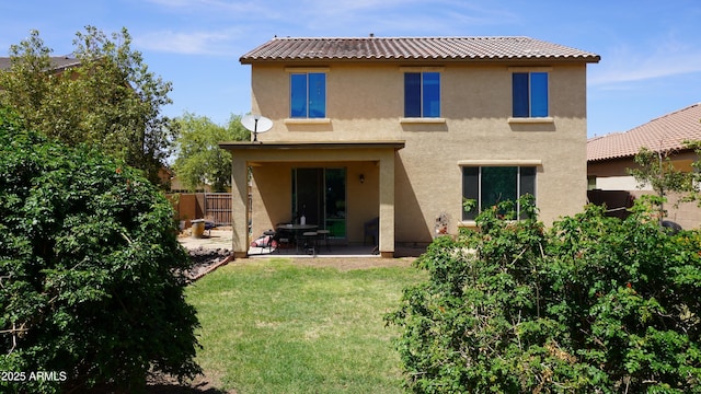 1309 W Park St, Phoenix, AZ 85041 - back of property with stucco siding, a patio, and a tile roof