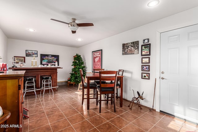 dining room with recessed lighting, a dry bar, ceiling fan, and dark tile patterned floors