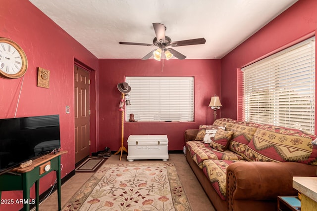 living room with carpet floors and ceiling fan