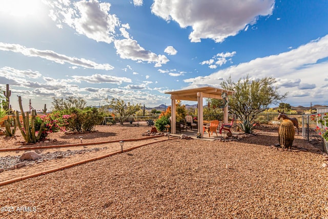 view of yard with fence, a patio, and a gazebo