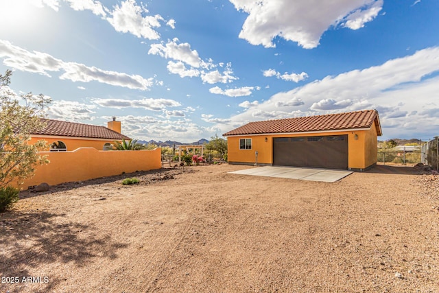view of yard with fence and an outbuilding