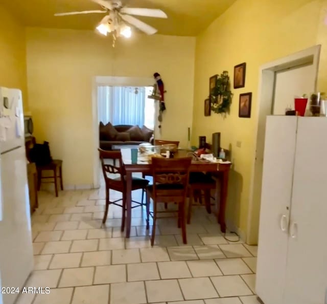 tiled dining room with ceiling fan