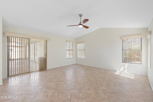 unfurnished room featuring light tile patterned floors, plenty of natural light, ceiling fan, and vaulted ceiling