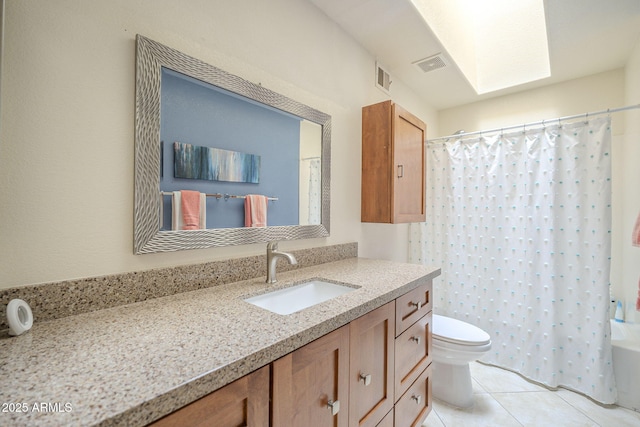 bathroom with toilet, tile patterned floors, visible vents, and vanity