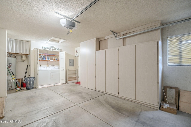 garage featuring concrete block wall, gas water heater, a garage door opener, washing machine and dryer, and electric panel