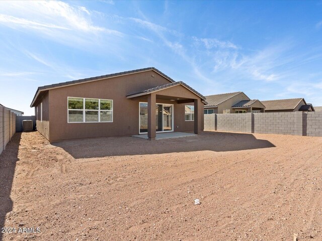 back of property featuring a patio