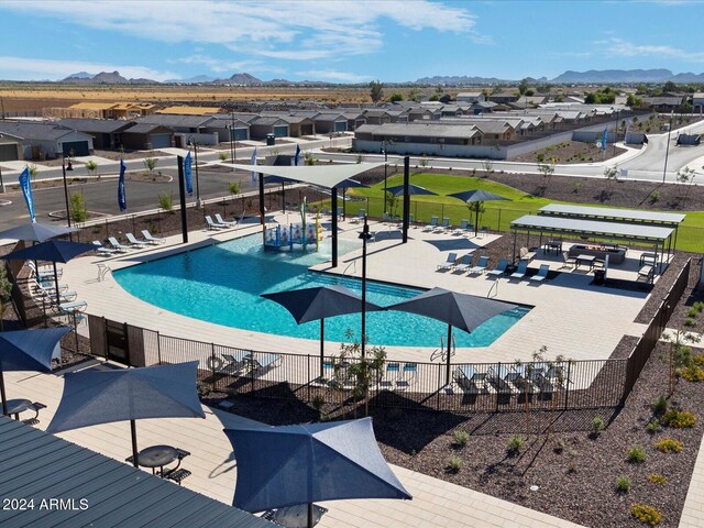 view of pool with a patio area and a mountain view