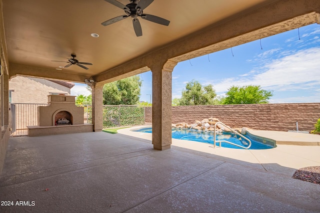 exterior space featuring a fenced in pool, ceiling fan, and exterior fireplace