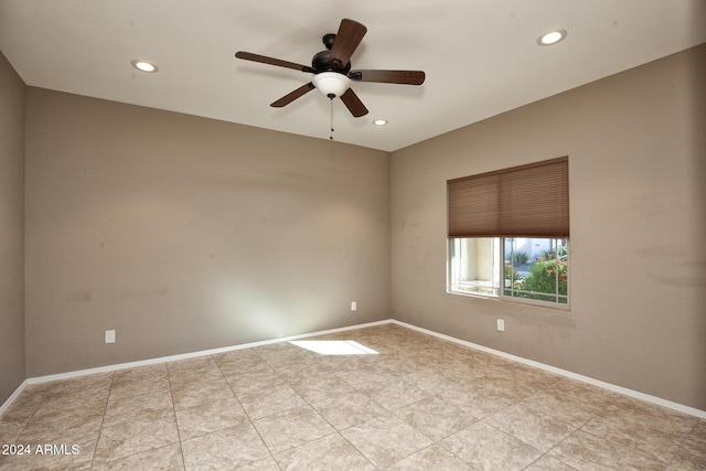 spare room featuring ceiling fan