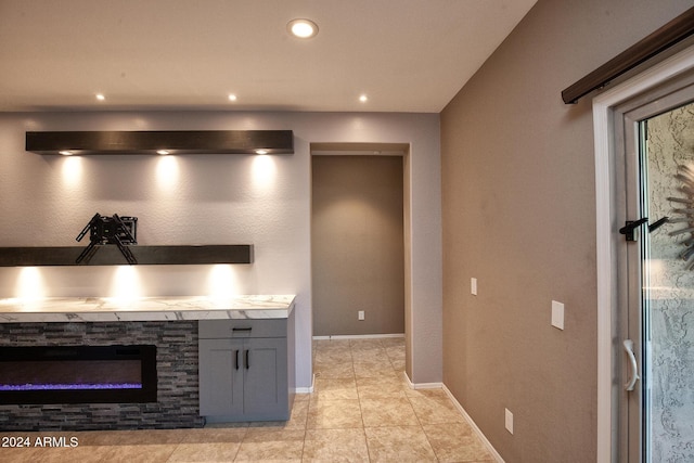 kitchen featuring gray cabinets and light tile patterned flooring