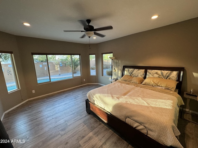 bedroom featuring hardwood / wood-style floors and ceiling fan