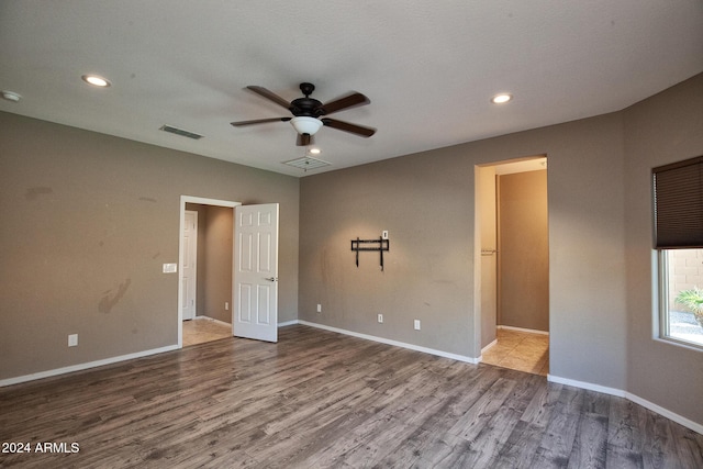 empty room featuring hardwood / wood-style flooring and ceiling fan