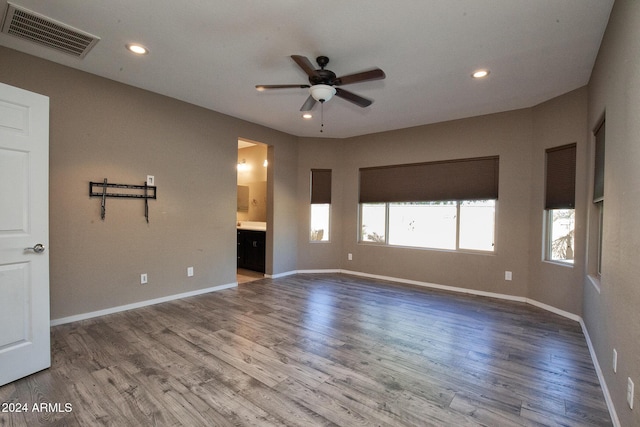 unfurnished room with hardwood / wood-style flooring and ceiling fan