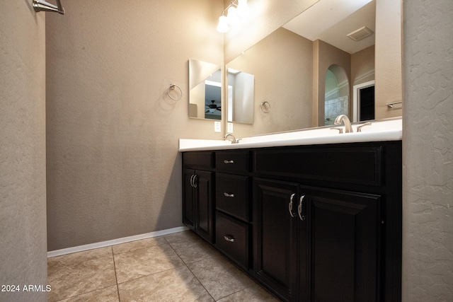 bathroom with tile patterned flooring and vanity