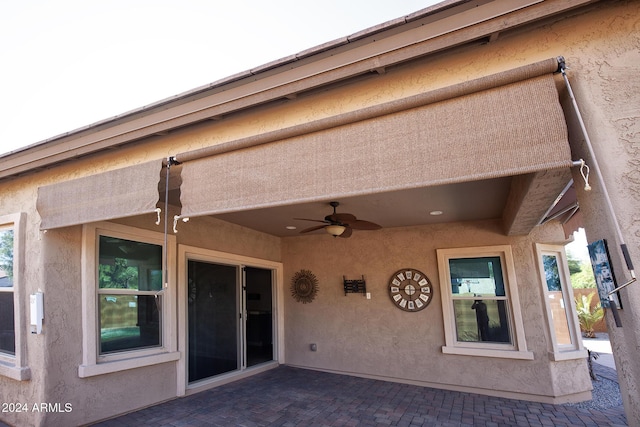 exterior space with a patio and ceiling fan