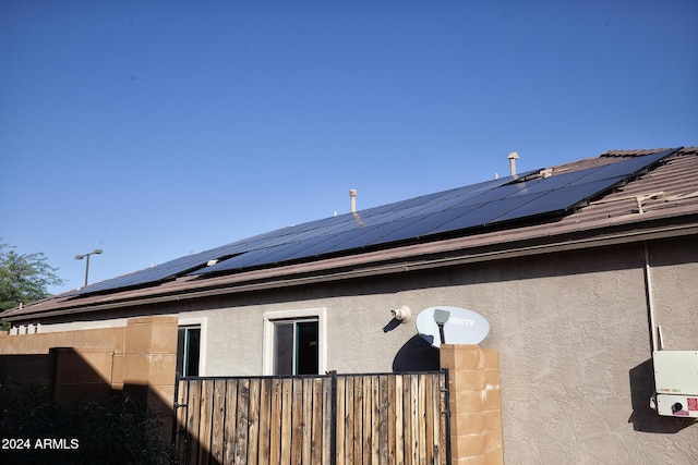 view of home's exterior featuring solar panels