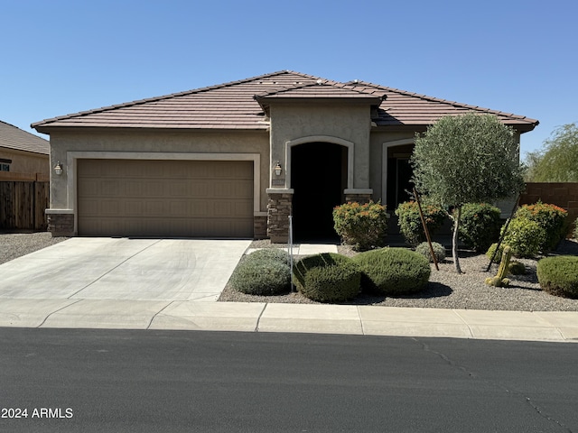 view of front of property featuring a garage