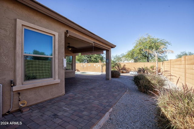 view of patio / terrace featuring ceiling fan