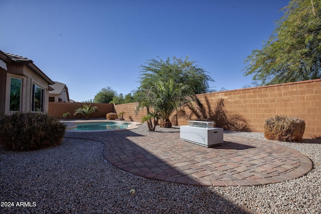 exterior space with a fenced in pool