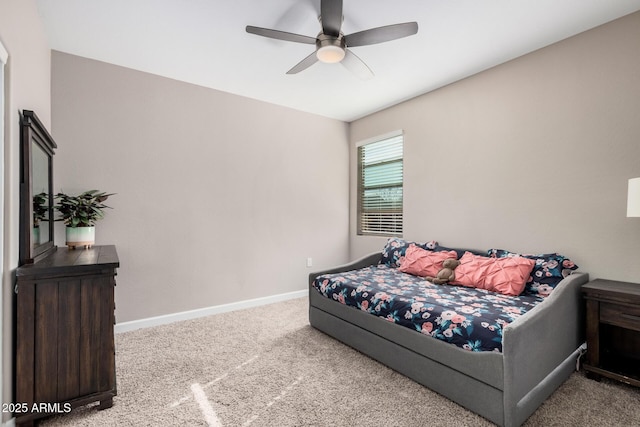 carpeted bedroom featuring a ceiling fan and baseboards