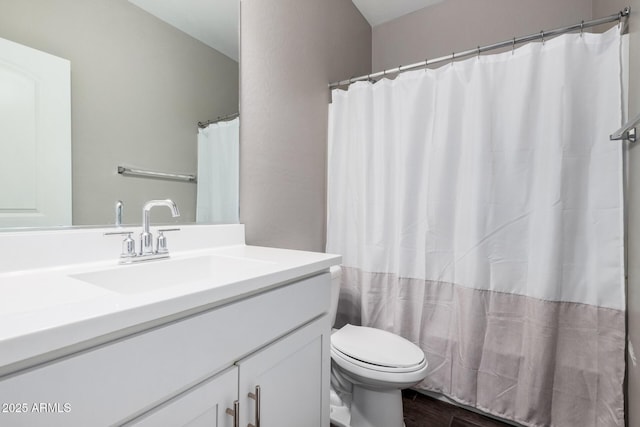 full bath with vanity, a shower with shower curtain, wood finished floors, and toilet