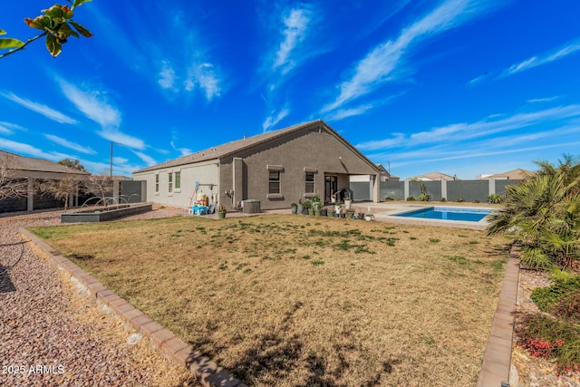 rear view of house featuring central AC unit, a fenced backyard, a vegetable garden, a fenced in pool, and stucco siding