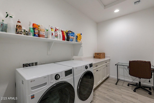 laundry area featuring light wood finished floors, recessed lighting, cabinet space, visible vents, and independent washer and dryer