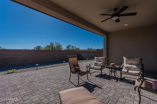 view of patio / terrace with a fenced backyard and ceiling fan