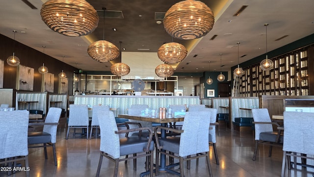 dining area with visible vents and an inviting chandelier