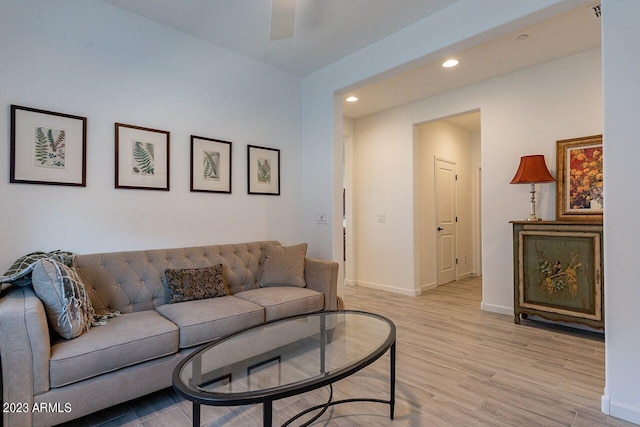 living area featuring light wood finished floors, recessed lighting, a ceiling fan, and baseboards