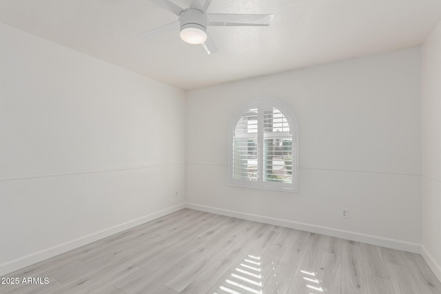 unfurnished room featuring ceiling fan and light wood-type flooring