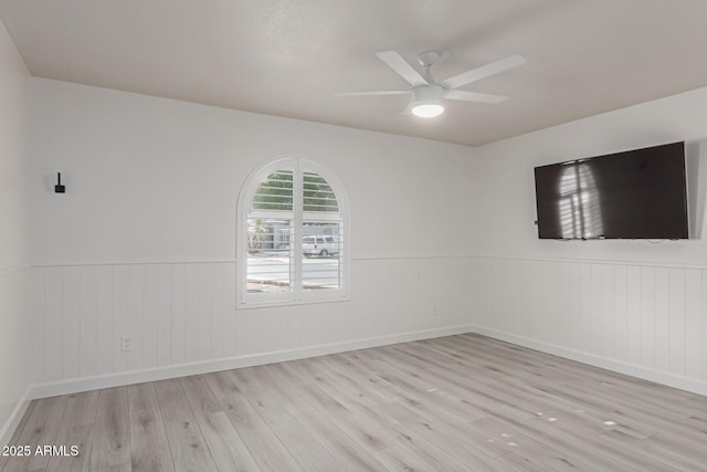 spare room with light hardwood / wood-style flooring and ceiling fan