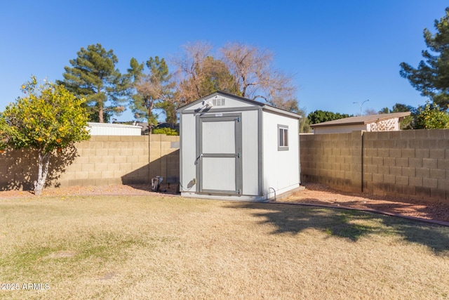 view of outdoor structure featuring a lawn