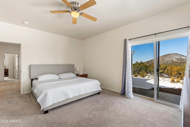 bedroom with access to exterior, light colored carpet, baseboards, and ceiling fan