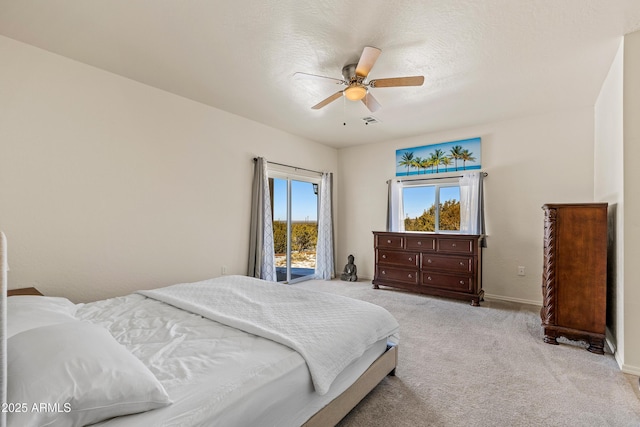 bedroom with baseboards, light colored carpet, and a ceiling fan