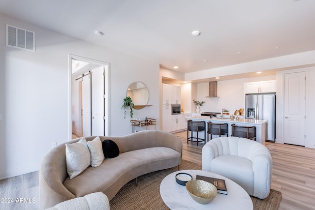 living room with light hardwood / wood-style flooring