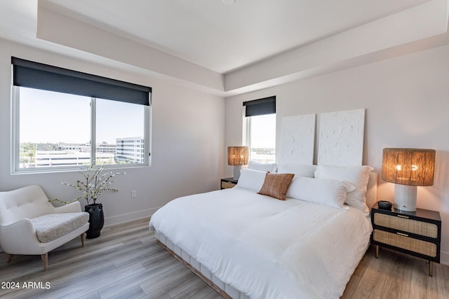 bedroom with light wood-type flooring