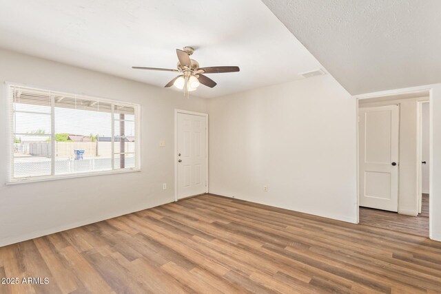 122 N 5th St, Avondale, AZ 85323 - unfurnished room with ceiling fan, wood finished floors, and baseboards