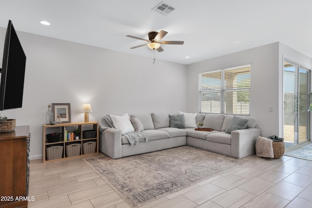 living room with wood tiled floor, visible vents, ceiling fan, and recessed lighting