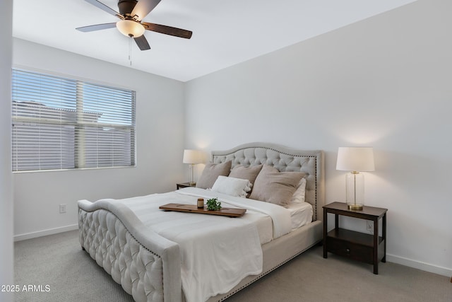 bedroom with light carpet, a ceiling fan, and baseboards