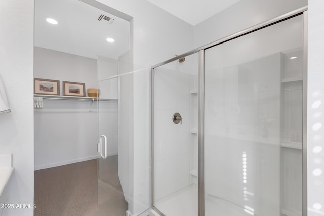 bathroom featuring a stall shower, visible vents, and recessed lighting