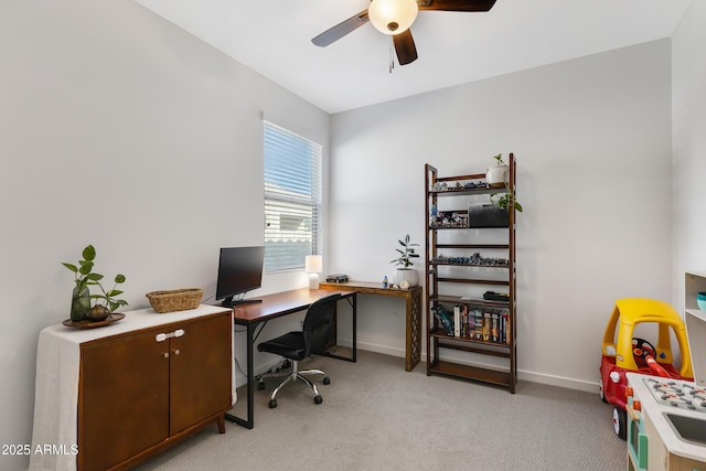 office with light colored carpet, ceiling fan, and baseboards